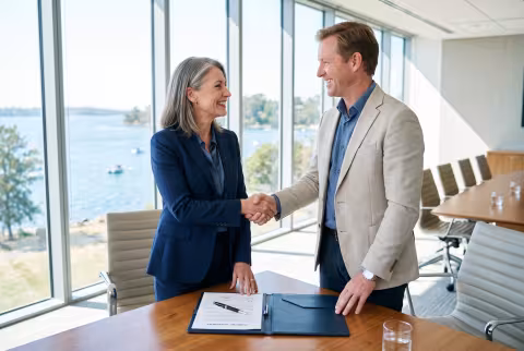 Grant announcement handshake — News imagery, funding.